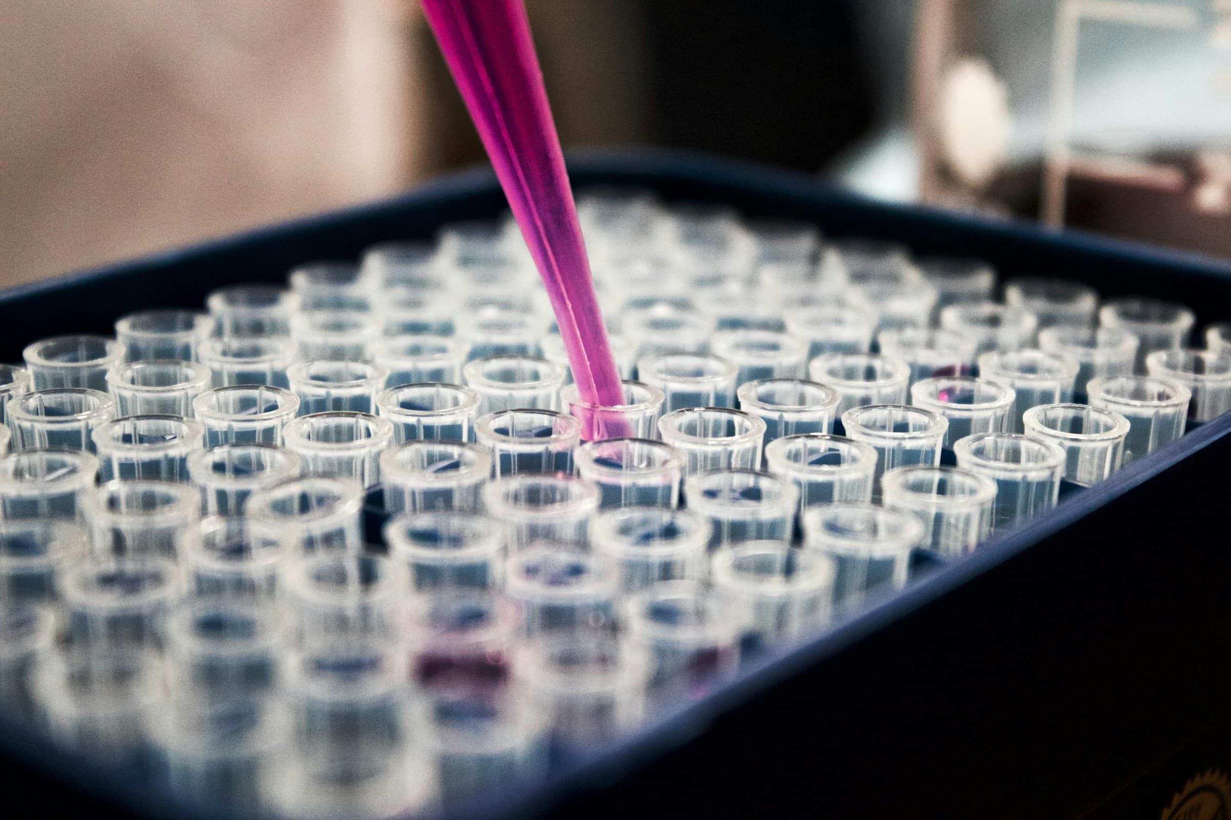 Pipetting into a multi-well analytical plate